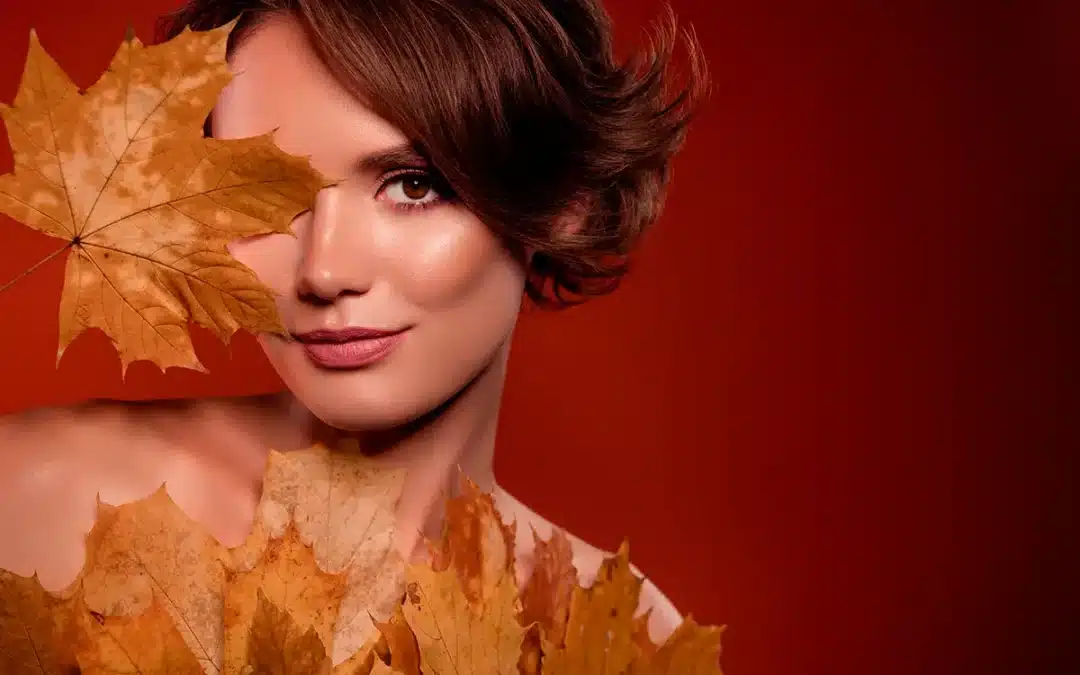 chic lady cover face with yellow maple leave new lotion extract for smooth facial skin