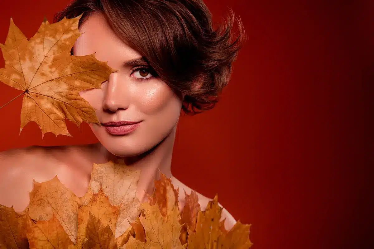 chic lady cover face with yellow maple leave new lotion extract for smooth facial skin chic lady cover face with yellow maple leave new lotion extract for smooth facial skin