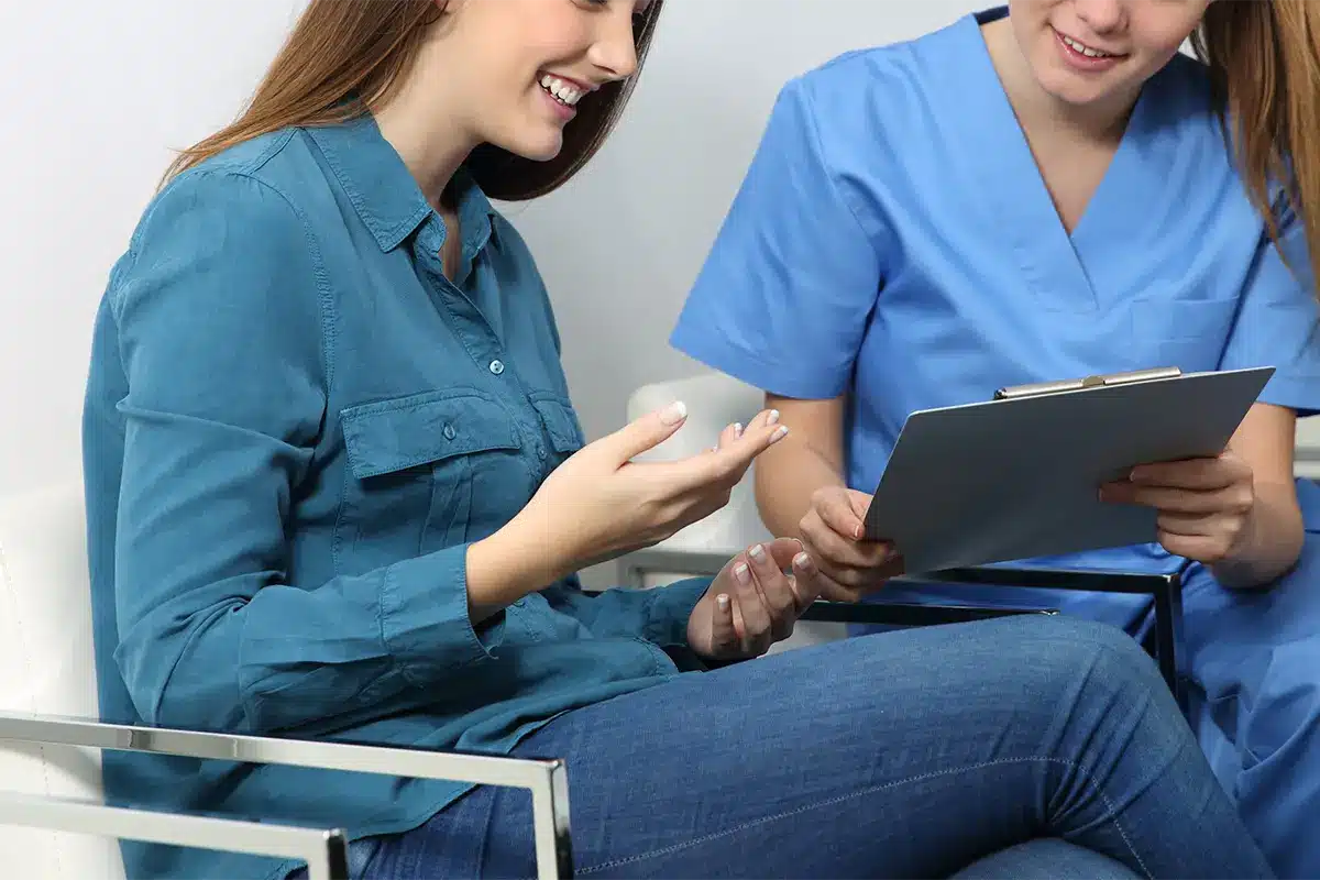 nurse explaining medical procedure to a patient nurse explaining medical procedure to a patient